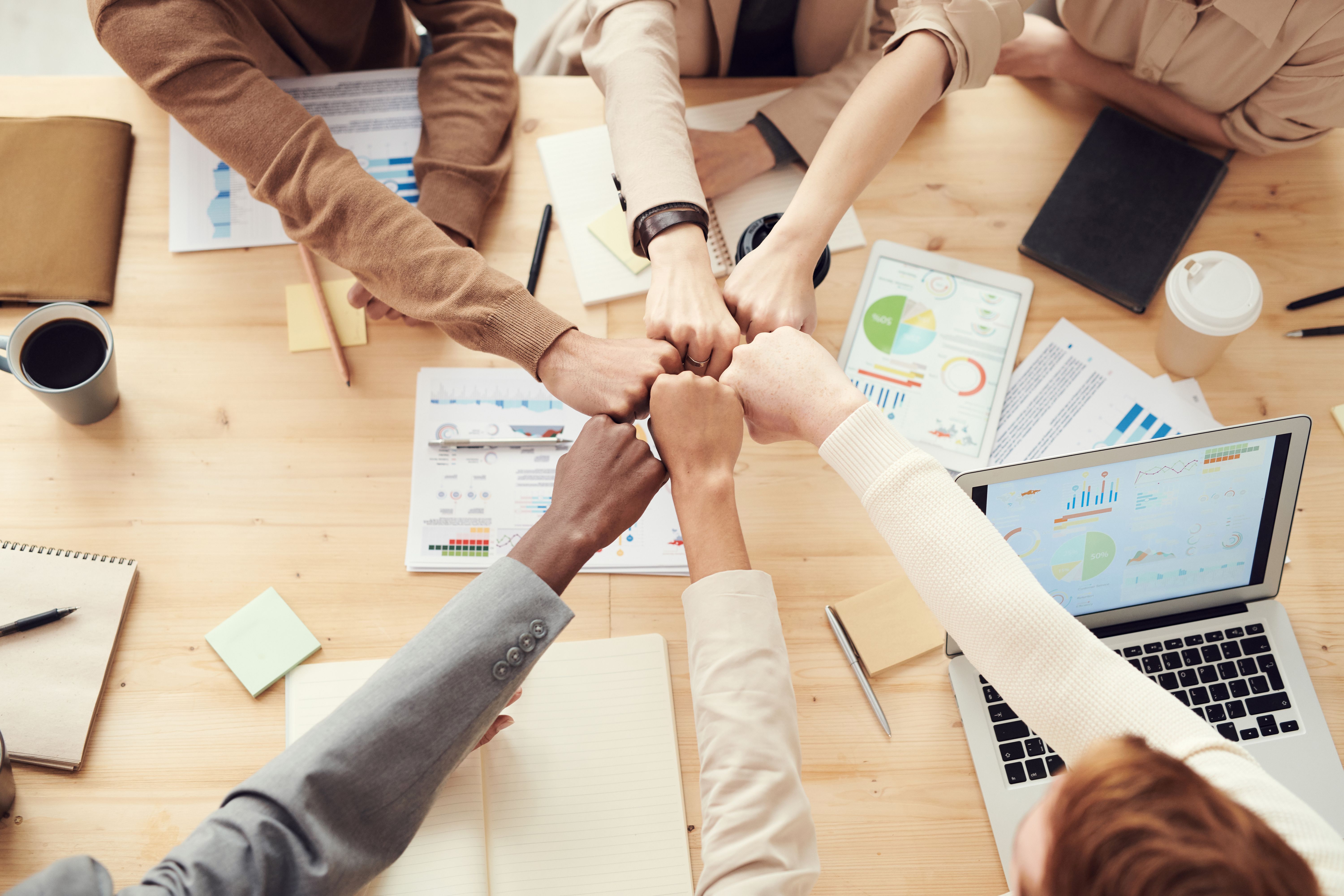 Financial professionals collaborating around a table