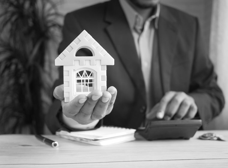 A property professional reviewing figures with a calculator