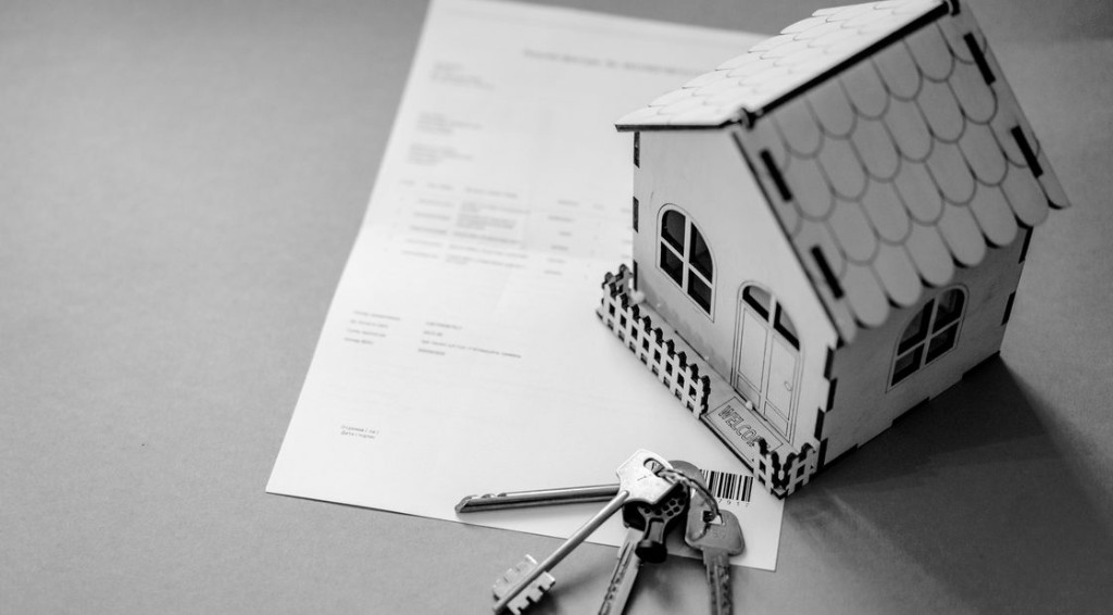 House keys and paperwork on a desk