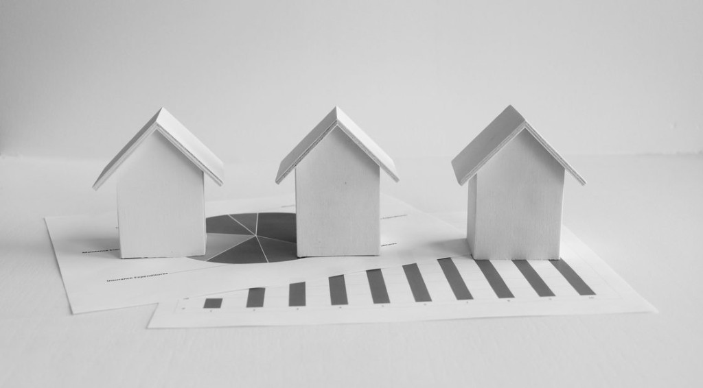 Three model properties resting on financial charts