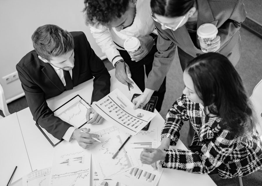 A property management team reviewing financial reports together